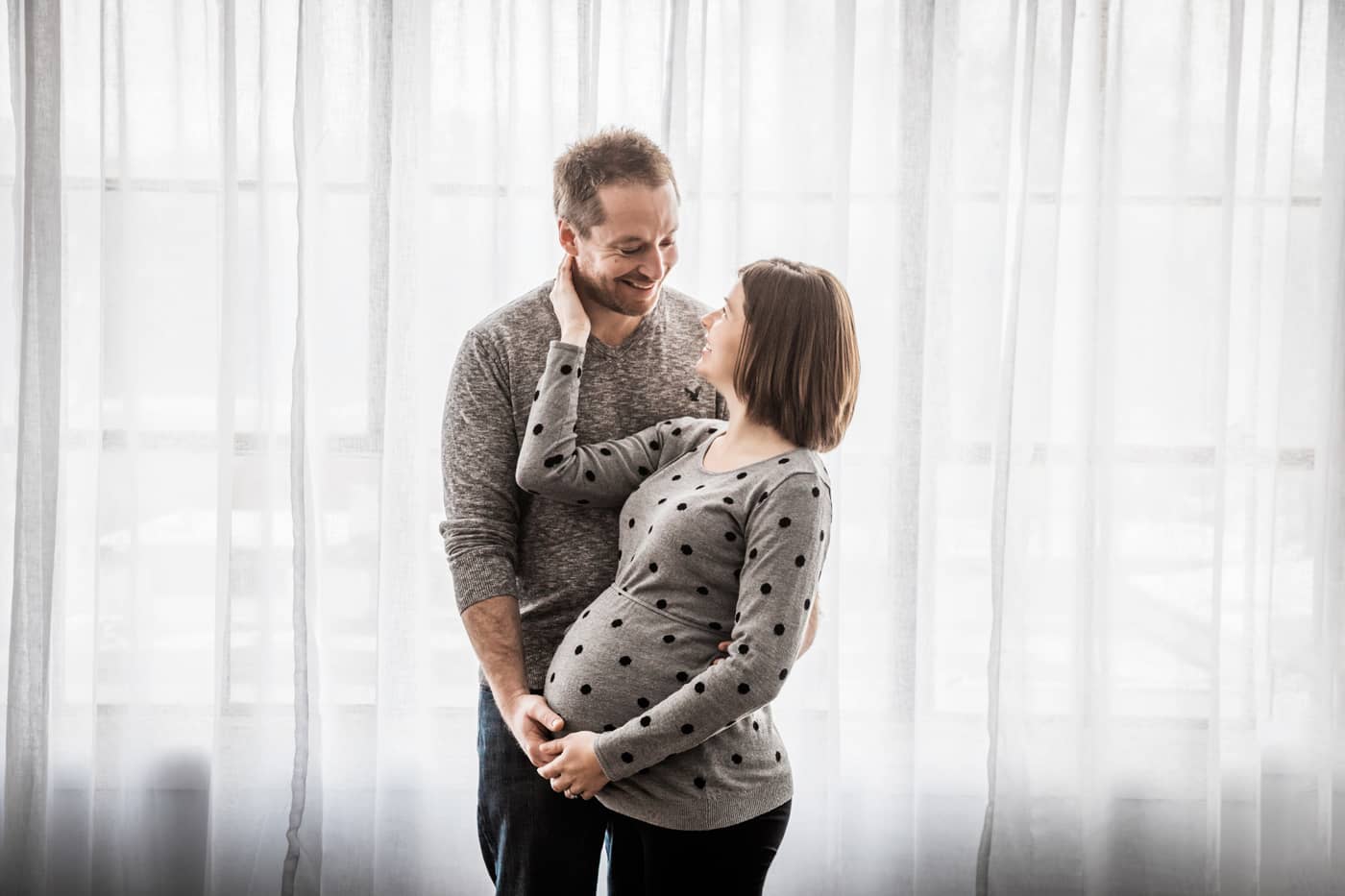 Pregnant lady and her husband in the studio. Owen Sound Family and Maternity Photographer