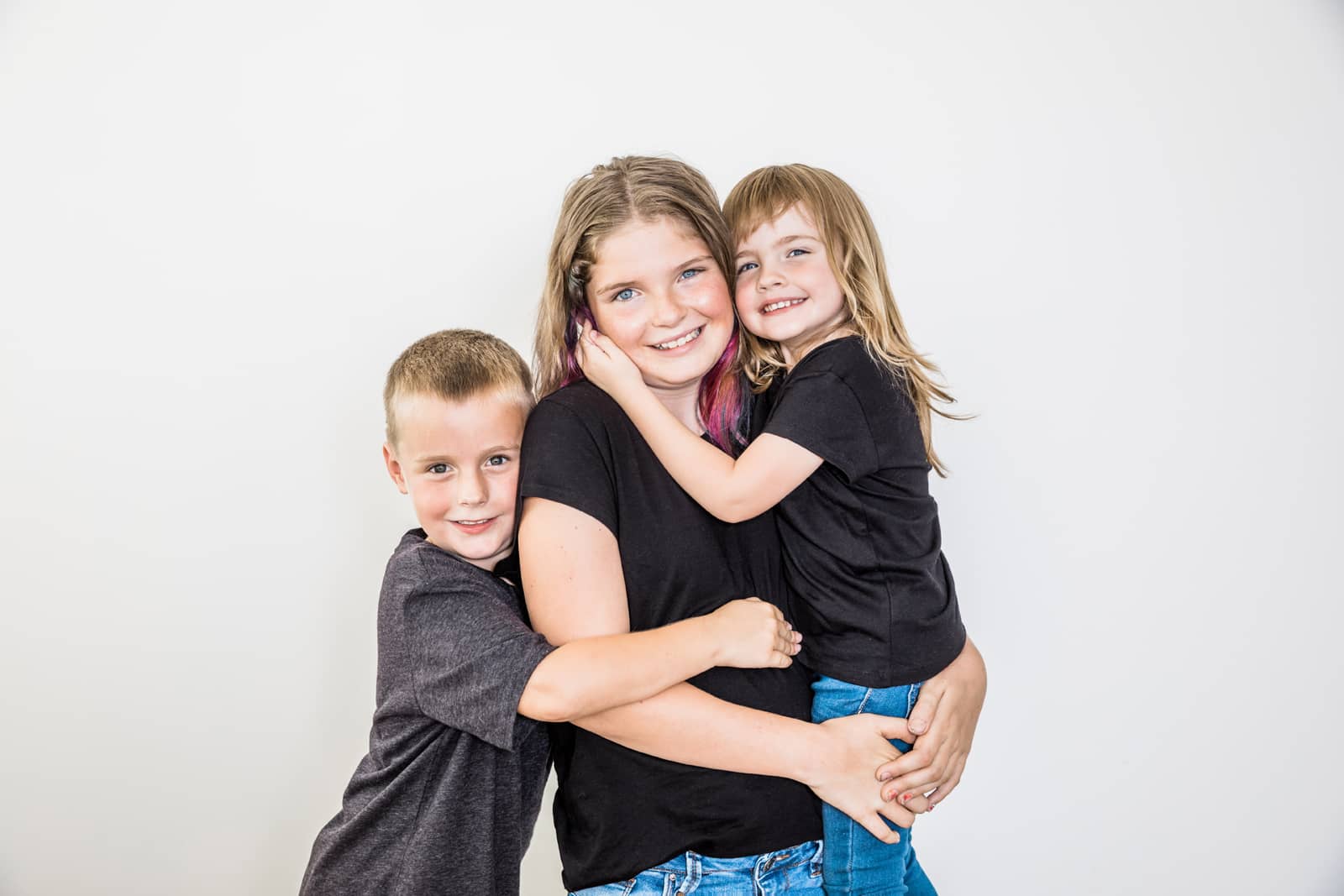 three children siblings in the studio. Owen Sound Family Photographer